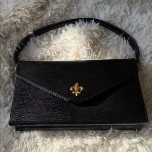 Elegant Black Handbag with Gold Accent